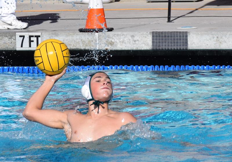 Senior field player Eric Maser scores on a volley from the left side of the pool in the 1st quarter. Photo by Ethan Kao. 