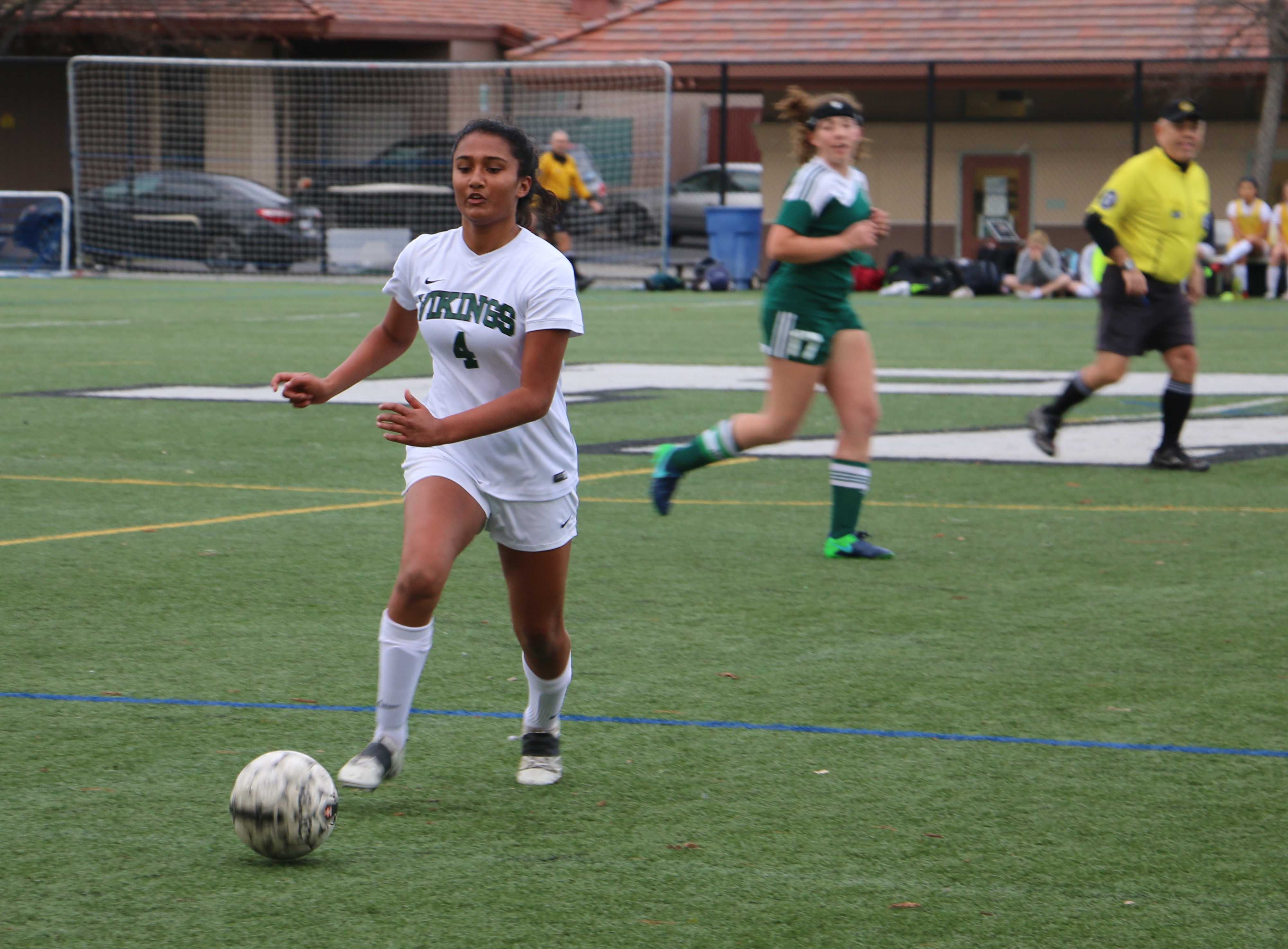 Sophomore Leena Srinivasan passes the ball in the second half. Srinivasan was dominant in the midfield tracking down loose balls and blocking the passing lanes. Photo by Ethan Kao.