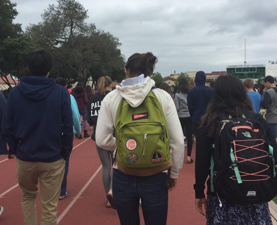 Palo Alto High School students exit the Viking Stadium after being dismissed from the fire alarm response gathering during fourth period today. Photo: Emma van der Veen.