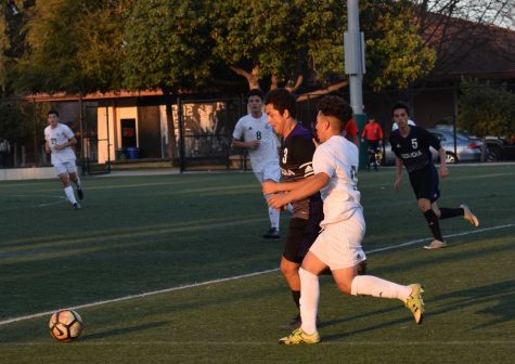 Junior Marco Tan dribbles past a defender and goes on to score the only goal of the game against Sequoia High School.  “This was my first goal of the season, Tan said. I had a few last year and it took four or five games to get back this year.”
