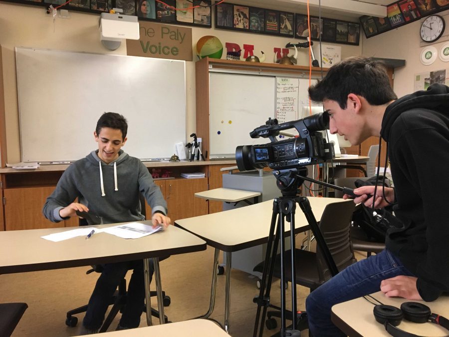 Junior David Foster, a coordinator for the community outreach subcommittee of the Innovative Schedule Committee, speaks to several members of Palo Alto High School's media program as the committee continues to deliberate. 