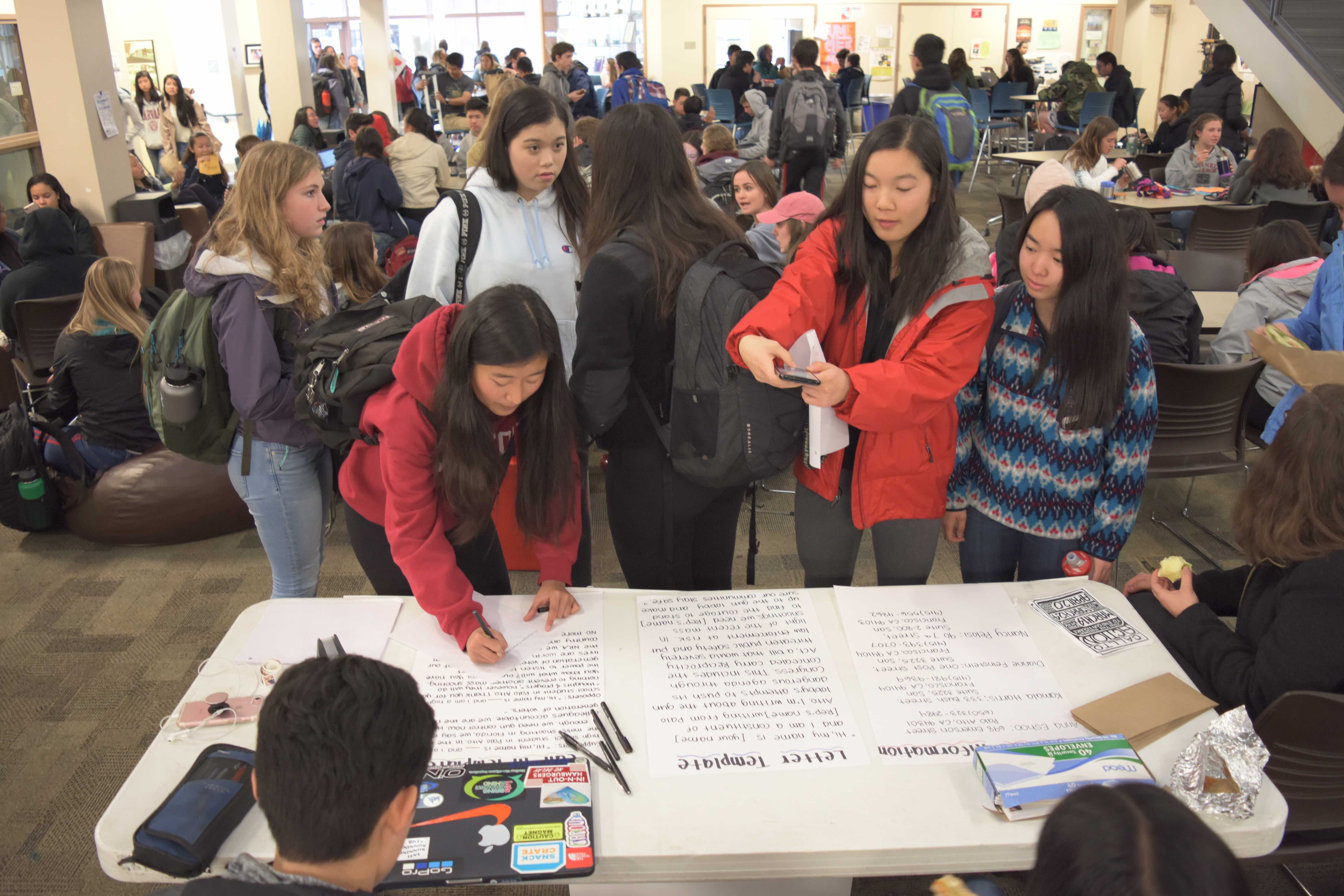 Palo Alto High School students participate in a student-led letter-writing and calling campaign organized in response to the high school shooting in Parkland, Florida. According to senior Noga Hurwitz, the campaign aims to send 500 letters to members of Congress including Anna Eshoo, Kamala Harris, Diane Fienstein and Nancy Pelosi. Photo: Nisha McNealis 