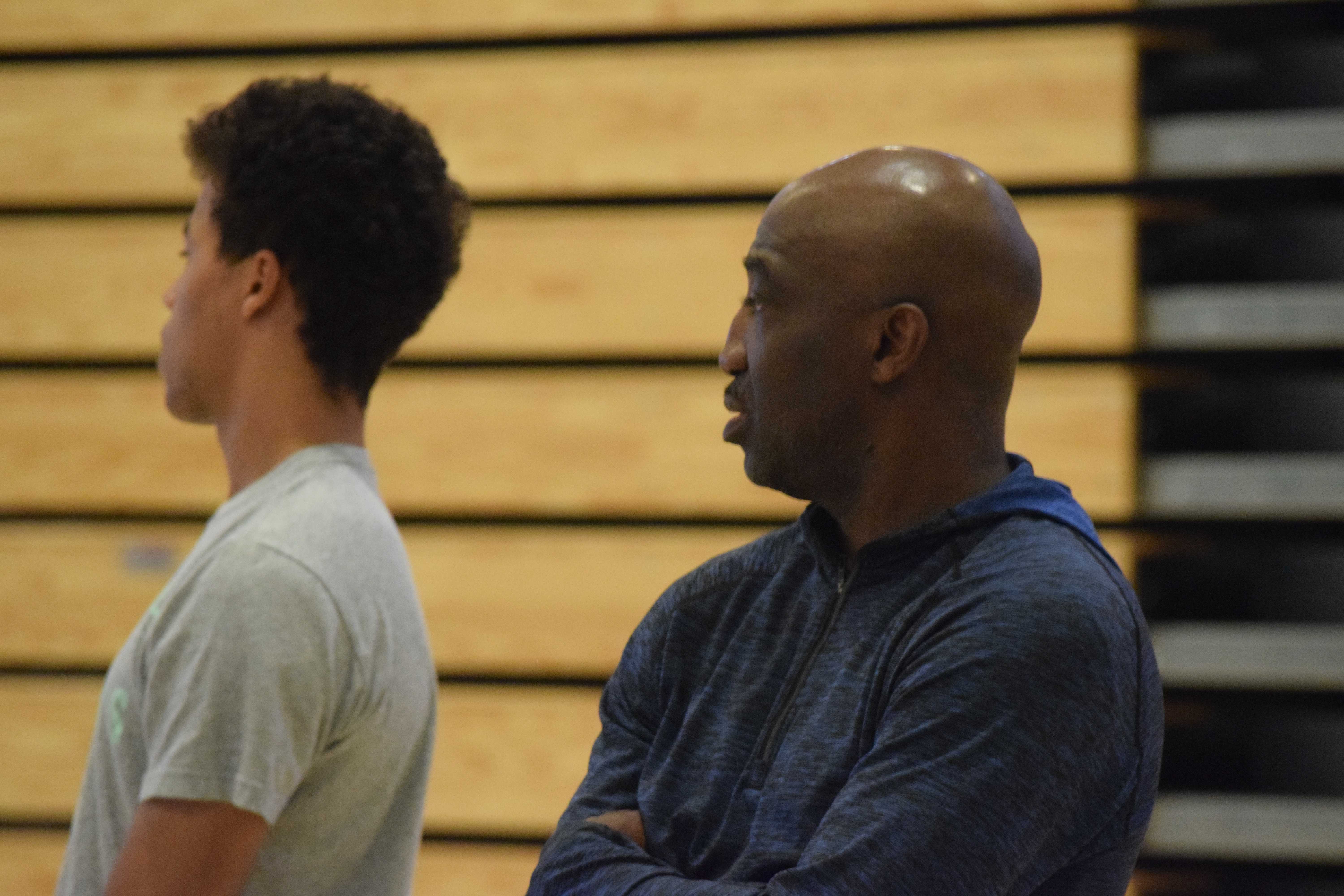 New boys basketball head coach Rodney Tention (left) observes a scrimmage to gauge the skills of his players next year. Tention has years of coaching experience, and looks to improve the team during his time here at Paly. “I want to challenge them, but make sure they understand they are good enough to be a top level team,” Tention said. Photo: Dylan Zou