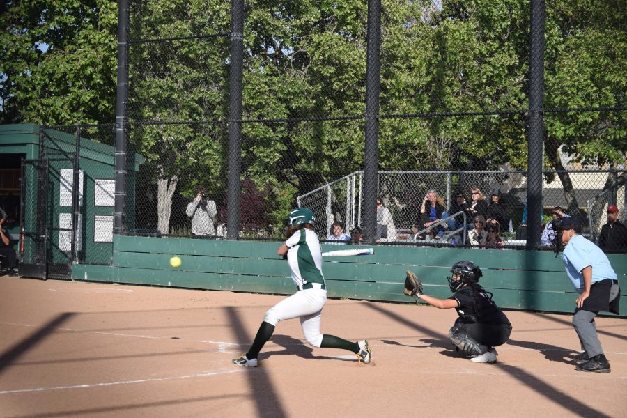Sophomore Zoe Silver swings at the ball in the first inning in a matchup against Gunn High School.