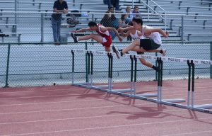 Boys' and girls' varsity track and field teams lose to Gunn (57-70, 58-67)