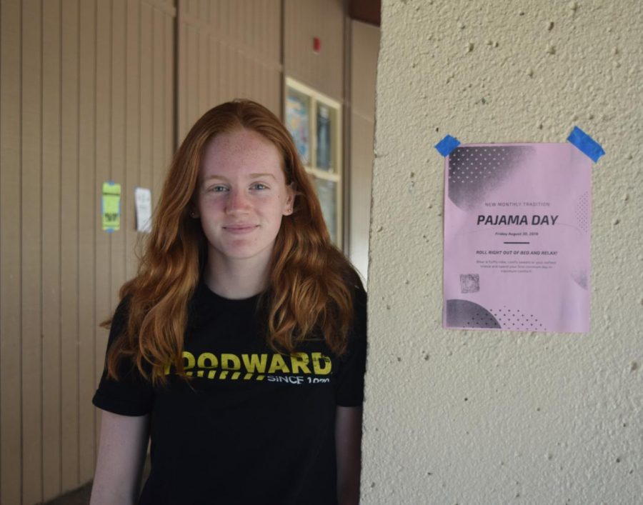 Junior Jenna Hickey stands next to one of the several posters placed around the Palo Alto High School campus advertising the first monthly Pajama Day this Friday. Although some students are excited about the event, Hickey expressed her concerns about the weather affecting student participation and attire. “I don’t think they should put it when it’s 80 degrees outside because I feel like people own more sweatpants and flannel [pants],” Hickey said. “I don’t think people want to come in short pajama shorts.” Photo: Sophia Krugler