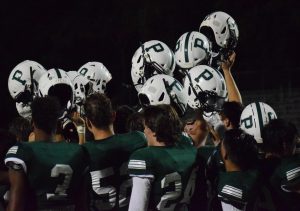 Varsity football triumphs in first home game of the season