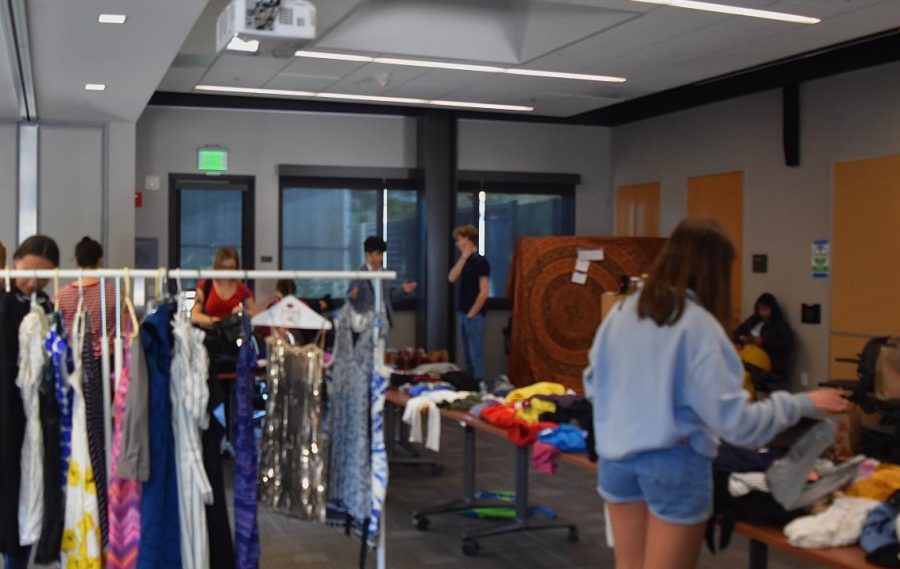 Teens trade clothing items at the Teen Arts Council Clothing Swap, Saturday. 