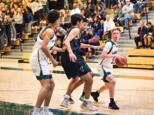 Boys' basketball remains undefeated in league with senior night win