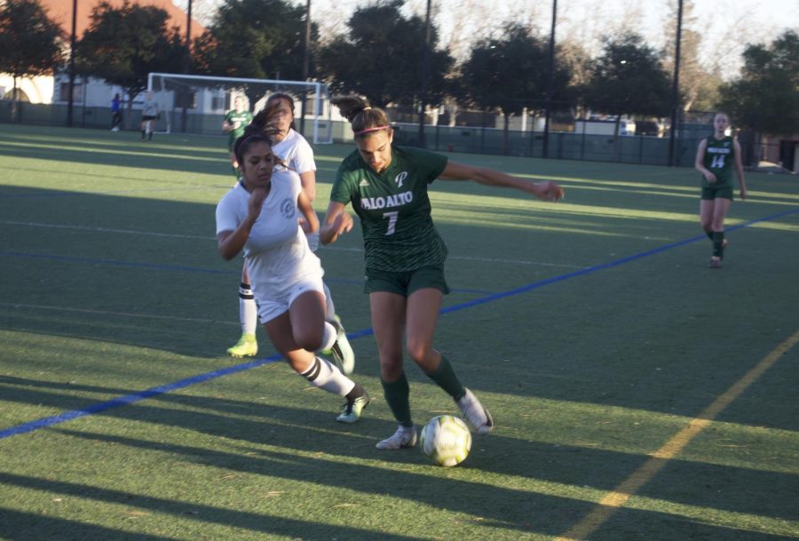 Senior+Leila+Khan+fights+to+keep+the+ball+moving+forward+as+she+pushes+her+way+past+a+Homestead+defender.+Photo%3A+Tara+Kapoor