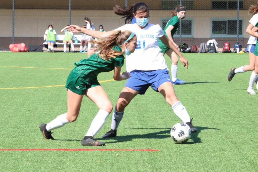 Freshman midfielder Josie Vogel attempts to steal the ball from an Eagle.