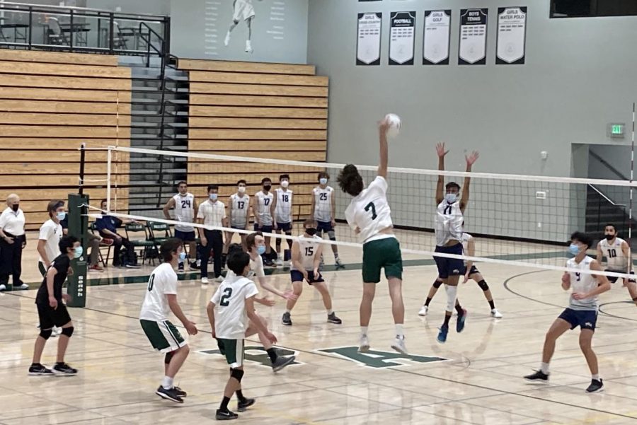 Junior+Evan+Passaleacqua+spikes+the+ball+over+the+net+during+the+last+varsity+boys%E2%80%99+volleyball+game+of+the+season+against+Kings+Academy+Friday+at+home.+According+to+head+coach+Ed+Yeh%2C+this+year+was+meant+for+rebuilding+and+preparing+for+next+season.+%E2%80%9CThis+year+was+always+a+weird+year%2C+and+always+a+rebuilding+year+because+we+lost+a+lot+of+seniors+last+year%2C%E2%80%9D+Yeh+said.+%E2%80%9CWe+actually+did+as+well+or+better+than+expected+this+season.%E2%80%9D