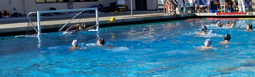 Junior Etain Green dives for the ball during the varsity boys water polo game Thursday at home. According to Green, the teams performance was an improvement compared to its previous games. I feel like we really executed on our defense, Green said. Coming into the game versus Los Altos we really broke down in the beginning of the third quarter [and] we lacked energy. So this [game] was kind of our bounce-back game.