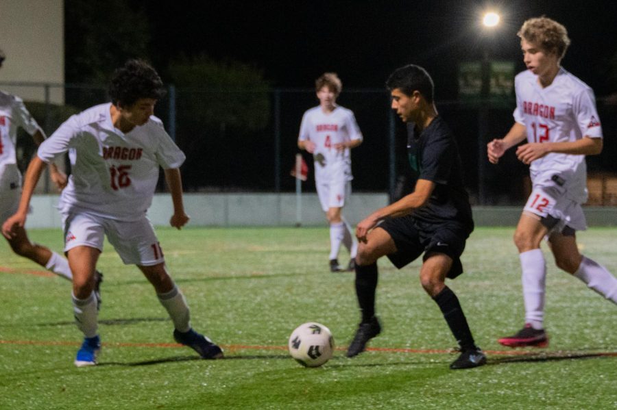 Paly+senior+midfielder+Noah+Adesnik+defends+the+ball+from+the+Aragon+High+School+Dons+during+the+Vikings+Friday+night+game+at+home.+According+to+Adesnik%2C+who+scored+the+first+goal+of+the+2-0+game%2C+the+Dons+made+a+good+effort%2C+but+scoring+early+gave+the+Vikings+the+advantage.+It+was+a+rough+second+half+but+we+scored+a+late+goal+to+seal+the+win%2C+Adesnik+said.+It+was+a+good+win%2C+it+was+team+effort.+%28Photo%3A+Jonathan+Chen%29