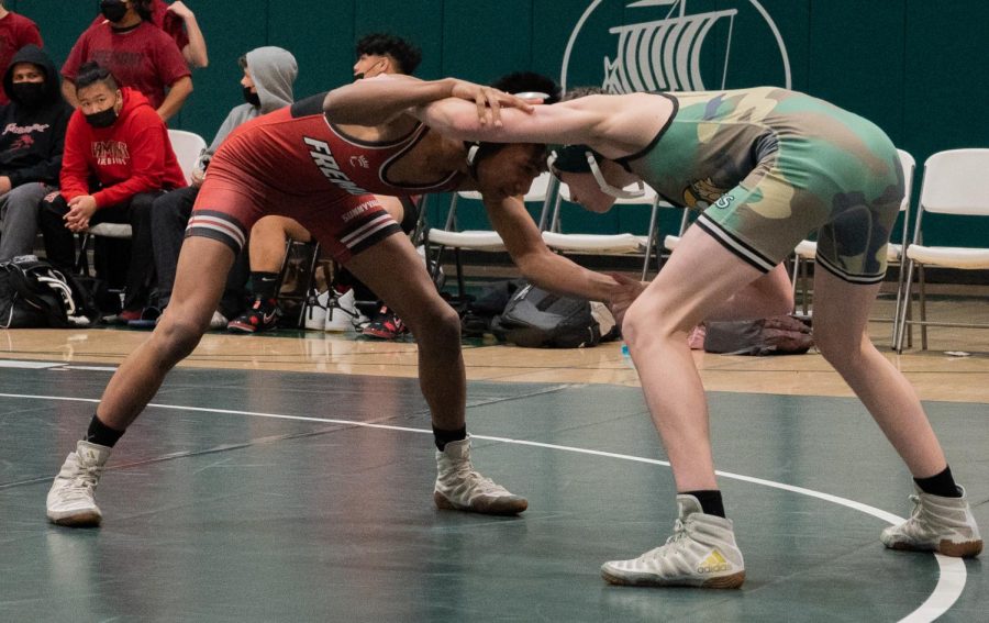 Palo+Alto+High+School+junior+Josh+Wilde+goes+head+to+head+with+his+opponent+during+the+Vikings+51-17+loss+to+Fremont+Tuesday+at+home.+Head+coach+Jon+Kessler+said+the+team+is+going+to+continue+training+after+this+loss.+%E2%80%9CWere+gonna+get+back+into+the+practice+room+tomorrow+and+were+gonna+work+hard%2C%E2%80%9D+Kessler+said.+%28Photo%3A+Jonathan+Chen%29