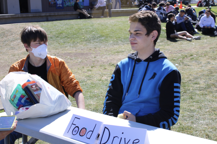 Senior Julien Keyani (right) and junior Ian Lawlor-hills (left) collect donations for the Homeless Outreach Program’s donation drive at lunch Thursday Feb. 24 on the quad at Palo Alto High School. The Paly club works to spread awareness about the topic of homelessness throughout the Bay Area. Lawlor-hills, a member of the club, said he believes this topic isn’t talked about enough on school campus and the Bay Area community in general. “Issues of class and equality I feel are often ignored around the Bay Area,” Lawlor-Hills said. “A lot of affordable housing bills have been rejected and so we [the club] try to do anything we can do to help mitigate it [homelessness].”