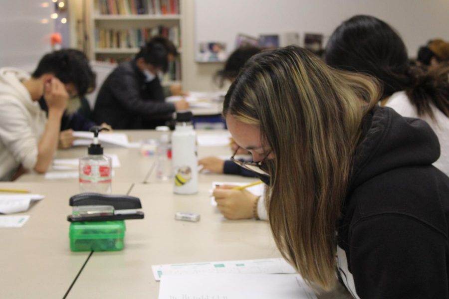 Students in teacher Melissa Laptalo's AP English Language and Composition class take a practice AP exam in preparation for the approaching test.