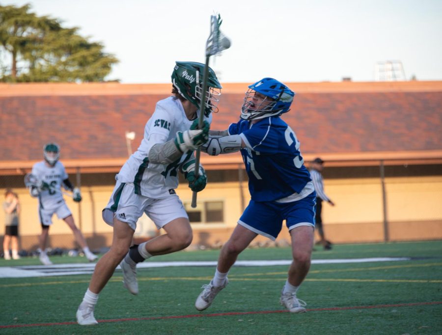 Viking+senior+attacker+Blake+Chase+sprints+past+a+check+by+an+Eagles+defender+during+their+9-3+victory+over+the+Los+Altos+on+Wednesday.+According+to+Head+Coach+Daniel+Shelton%2C+Palys+loss+to+Los+Altos+earlier+in+the+season+did+not+affect+the+teams+mindset.+%E2%80%9CIt+was+more+of+a+challenge+to+play+back+to+back+games%2C%E2%80%9D+Shelton+said.+%E2%80%9CWe+played+last+night+and+it+was+a+really+tough+game%2C+so+coming+on+tonight+was+just+kind+of+an+endurance+test+more+than+anything.%E2%80%9D+%28Photo%3A+Jonathan+Chen%29