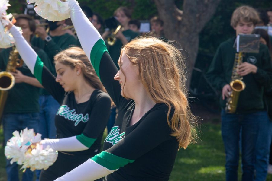 Palo Alto Dance Team members Bella Daly and Victoria Senderzon perform their routine while the Pep Band plays Stevie Wonder’s “Sir Duke”. The team and Paly’s band participated in the May Fete Parade on Saturday, and for many of the participating students, it was their first time in the parade. “It was a super fun experience,” Daly said. “I really had a great time and it was kind of our last big event of the year. It was a nice way to end.” (Photo: Daniel Garepis-Holland)