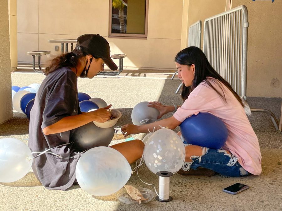 In preparation of last years homecoming dance, Associated Student Body members Ines Legrand and Cindy Wang create lantern decorations. According to Legrand, ASB social commissioner, unlike last years ice cream taco truck, students will have access to a mini doughnut truck.
“We have basic snacks like bags of chips, and popcorn like we had last year,” Legrand said. “Well also have fresh doughnuts on the spot and theres a topping bar where you can put toppings on, and you’ll have a little basket of donuts, and they look really good.” (Photo: Leena Hussein)