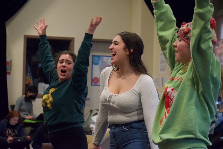Junior Annalise Belle Klenow (right), and Seniors Arielle Blumenfeld (center) and Rebecca Helft (left) rehearse a scene from Palo Alto High School’s theater program’s “Mamma Mia!”. According to Blumenfeld, a struggle in producing a musical with many students involved is getting to know everyone on a deeper level. “Because [“Mamma Mia!”] is so big, getting to know every single person and everyones styles and techniques is hard, although its definitely also the most rewarding part of it,” Blumenfeld said. “Being able to work with so many new people, and also developing those relationships [with everyone] because that needs to happen before opening night.” (Photo: Leena Hussein)