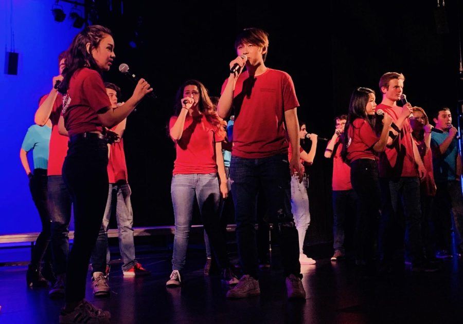 Students perform at the Palo Alto High School Pops concert in 2019 with the theme of ‘2000s party in the PAC.’ According to Choir junior Kyle Lehman, the Pops concert gives singers the freedom to sing songs they choose. “The Pops concert is unique because every student can do a solo song duet or a group song if they want to, and so we have a lot of people who are doing songs by themselves,” Lehman said. (Photo: Soumya Jhaveri)