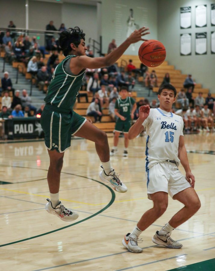 Viking junior Alaap Nair throws the ball at a Bellarmine College Preparatory player to regain possession Thursday night at the Central Coast Section semifinals. The Palo Alto High School Vikings lost to the Bellarmine College Preparatory Bells, 40-56, in a game summarized by Bell dominance. According to Bell head coach Alex Sarrett, the team always has to work towards the next game so that they can improve themselves constantly. “We’re never a finished product,” Sarrett said. “Our fundamentals are always going to be our fundamentals, our non-negotiables will remain the same, and we will emphasize those and double down on them.” (Photo: Annelise Balentine)