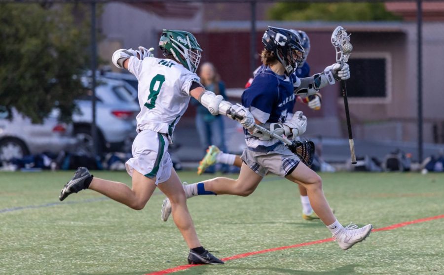 Viking+junior+defender+Tyler+Harrison+checks+a+Scot+in+an+attempt+to+stop+his+progress+during+the+teams+14-6+victory+over+Carlmont.+According+to+senior+attacker+Asher+Friedman%2C+the+teams+work+in+practice+prepared+them+for+Tuesdays+win.+I+think+we+went+to+practice%2C+worked+on+running+our+plays%2C+make+sure+we+knew+our+offense%2C+made+sure+that+everyone+knew+how+to+play%2C+because+we+knew+that+wed+have+to+go+deep+with+our+team%2C+and+we+came+back+and+got+a+solid+one%2C+Friedman+said.+%28Photo%3A+Daniel+Garepis-Holland%29