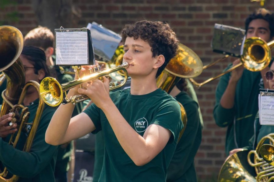Sophomore Lorenzo Maino performs alongside members of Palo Alto High Schools band during the May Fete parade in 2022. Both the band and the orchestra students will be leaving on a trip from April 20 to April 23 to visit New York City. According to freshman Amily Zhang, she is one of many students in the ensemble who is looking forward to the event. Im really excited for the New York trip, Zhang said. I am most looking forward to the Broadway shows in Radio City. (Photo: Daniel Garepis-Holland)