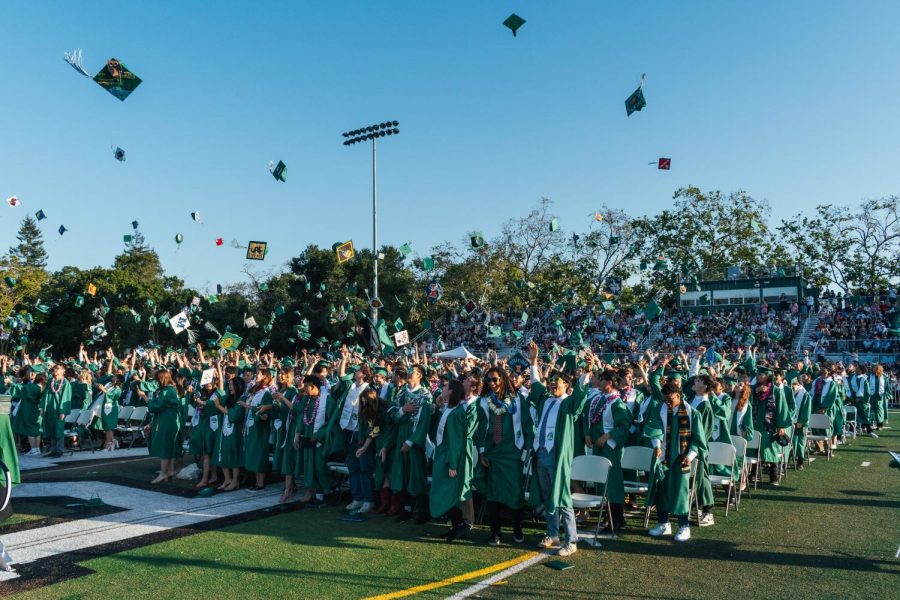 The Palo Alto High School graduating class of 2023 tosses their hats at the end of the graduation ceremony on Thursday at the Viking Stadium. Senior Arielle Blumenfeld reminded the graduating class of the paths they have traversed throughout their journey at Paly. “Another thing we need to realize is not only are we leaving behind a multitude of memories, but also we will leave behind our legacies since our first day at Paly,” Blumenfeld said. “Each memory shared here, each English essay used as an example for future periods, and each trophy you worked so hard to win … has occurred throughout our time here.” (Photo: Jeremy Dukes)