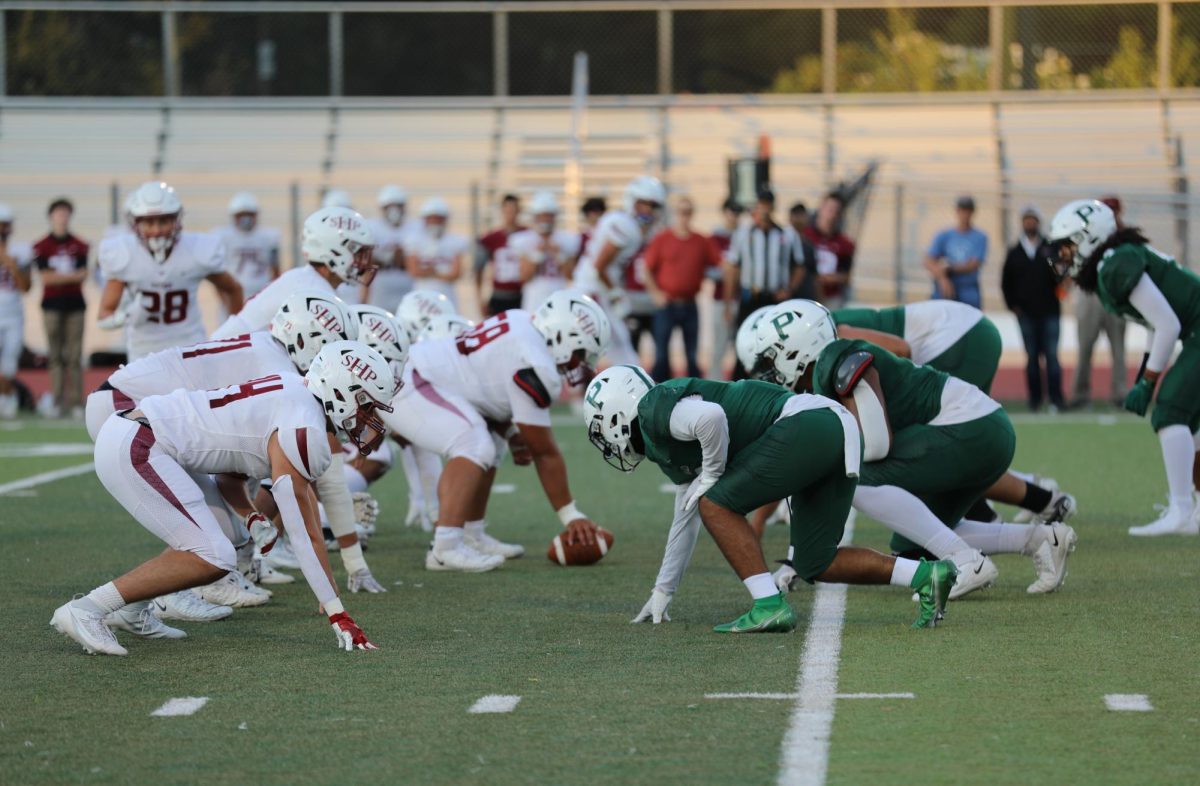 The Palo Alto High School Vikings defense lines up against the Sacred Heart Preparatory Gators during a match that marked the renaming of the Viking stadium on Saturday night. The Vikings suffered a 14-28 defeat to the Gators after Sacred Heart overpowered the Vikings defense with running plays. According to Vikings head coach David DeGeronimo, the Vikings played well despite the loss. We wanted to keep things rolling, and we felt pretty good about it, DeGeronimo said. We thought we had a good game plan. We just made more mistakes than they did. (Photo: Ketan Altekar-Okazaki)