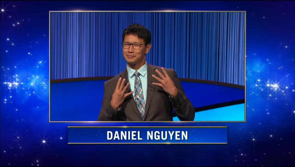 During Tuesdays Jeopardy! episode introduction, Palo Alto High School math teacher Daniel Nguyen flashes a 4s Up sign as a shout-out to his alma mater, the University of California, Los Angeles. (Photo: Sony Pictures Television)