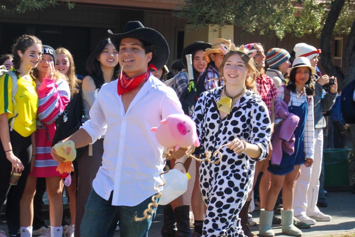 Two sophomores strut down the red-carpet to showcase their ranch themed outfits.
