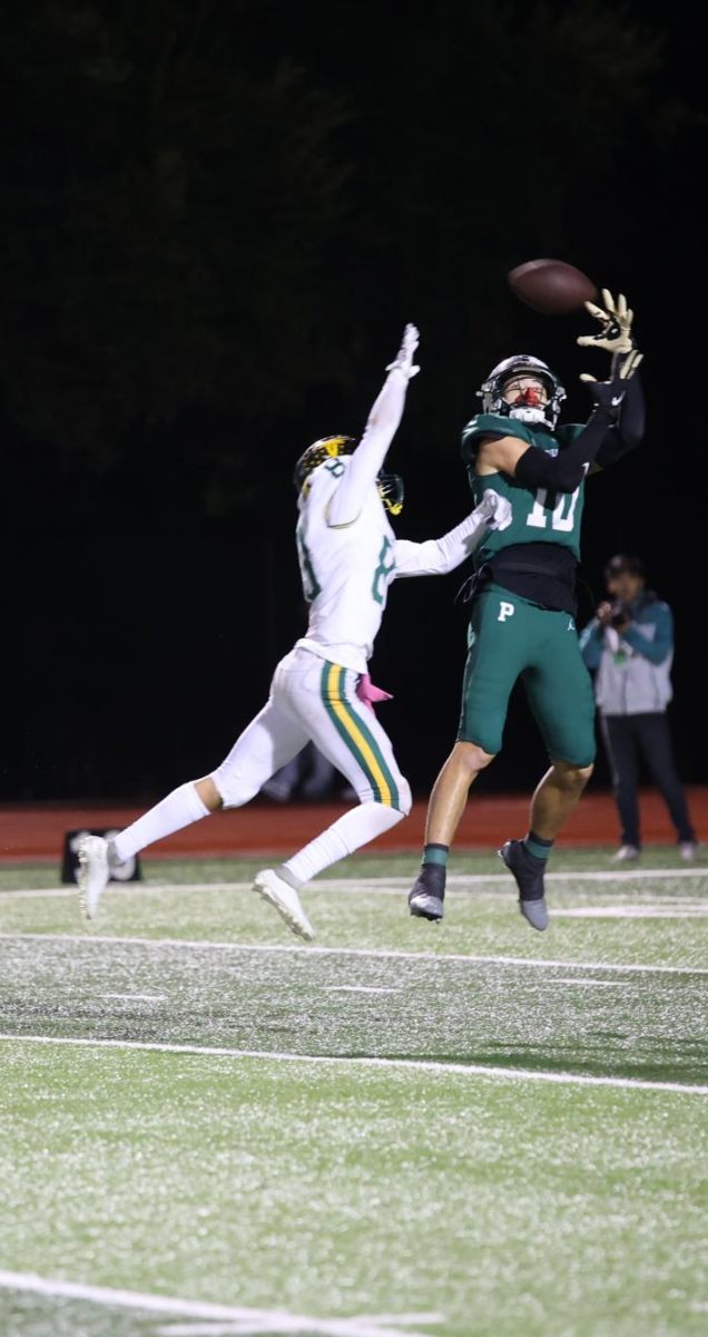 Palo Alto junior reciever Jeremiah Fung leaps for a touchdown pass against the Leigh Longhorns friday. Fungs says that his preperation and dedication to the program has set him up for satiurday, and he is ready to give his all. “All I can do is compete to the best of my ability” Fung said.