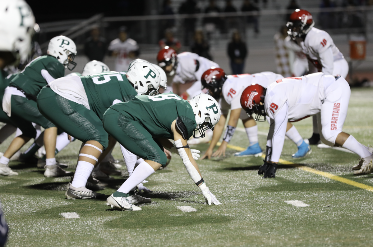 The Viking’s offense lines up against the Spartans in the first round of Division 4 Central Coast Section playoffs on Friday at home. The Vikings routed the Spartans in a 55-21 victory on Friday. According to Viking head coach David DeGeronimo, the Vikings wore out the Spartans throughout the match, both physically and mentally. “We had a good game plan,” DeGeronimo said. “They made some good plays, but I think we just kind of kept wearing them down once they realized they couldnt stop us. Its hard for them to keep coming throughout the game.” (Photo: Maxwell Zhang)