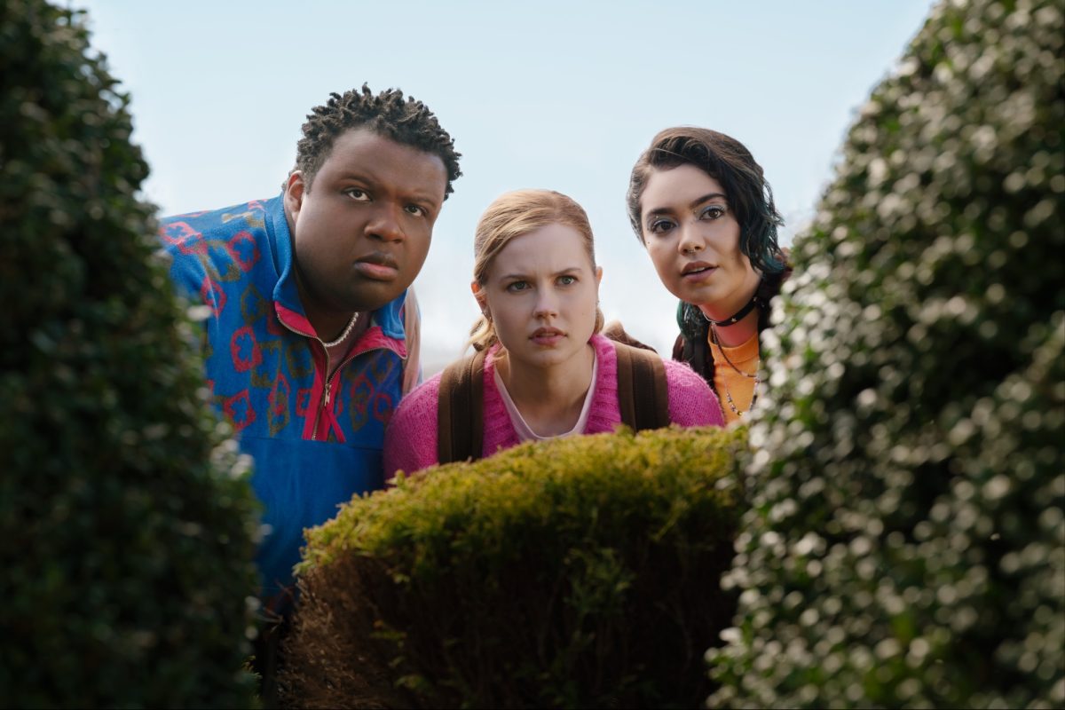 Cady Heron (Angourie Rice) and her friends Damian Hubbard (Jaquel Spivey) and Janis Imiike (Aulii Cravalho) spy on the Plastics behind a bush. (Photo: Jojo Whilden/Paramount Pictures)