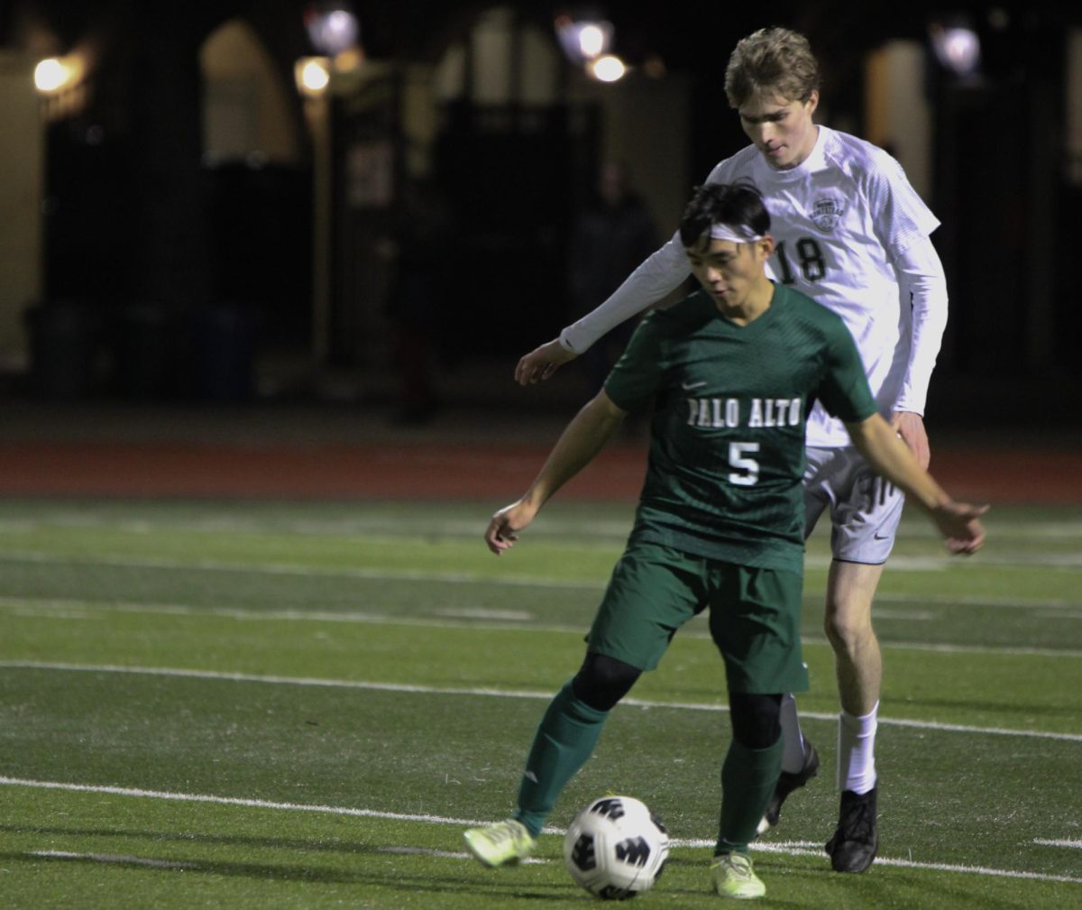 Palo+Alto+High+School+Viking+senior++midfielder+Richard+Ogawa+defends+the+ball+from+a+Homestead+High+School+Mustangs+defender+during+the+boys+varsity+soccer+game+on+Tuesday.+The+Vikings+defeated+the+Mustangs%2C+4-0%2C++keeping+their+chance+to+qualify+for+the+Central+Coast+Championship+alive.+According+to+Mustang+head+coach+Adam+Clarke%2C+both+teams+were+extra+eager+to+win+given+what+was+at+stake.+%E2%80%9CTonight+was+brutal%2C+Clarke+said.+We+needed+to+win+to+make+the+playoffs%2C+and+we+also+knew+that+Paly+also+had+to+win.+There+was+a+lot+at+stake+coming+into+the+match%E2%80%9D.+%28Photo%3A+Joy+Tan%29