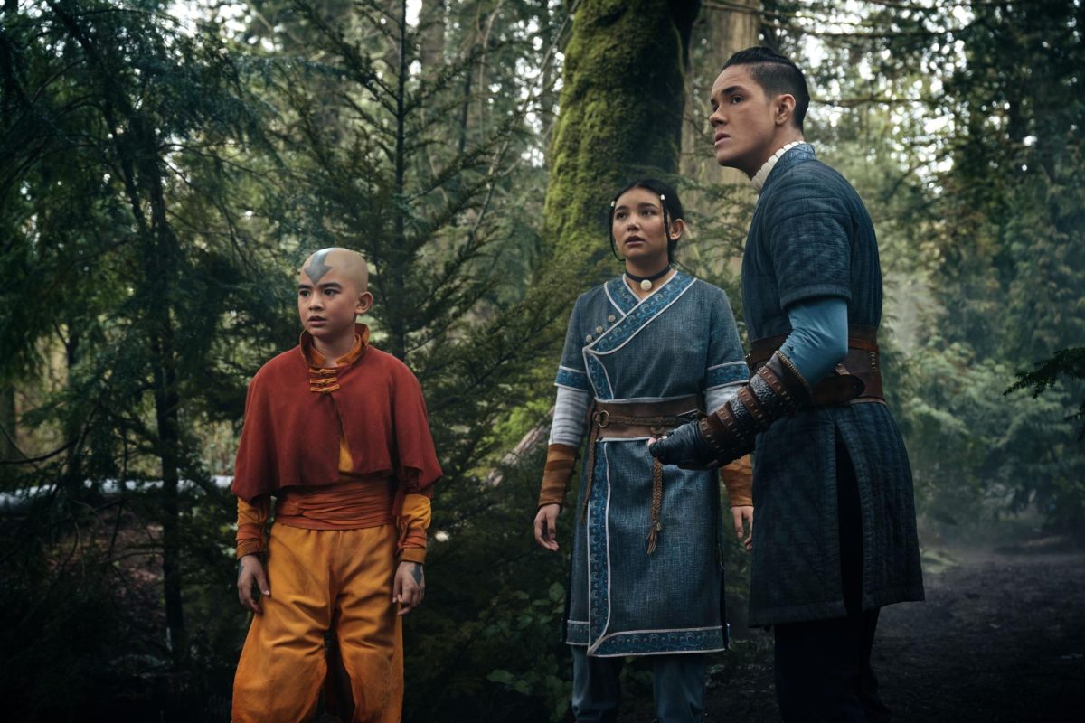 Avatar Aang (Gordon Cormier), Katara (Kiawentiio), and Sokka (Ian Ousley) looks in horror as a army of fire nation soldiers approaches them. 