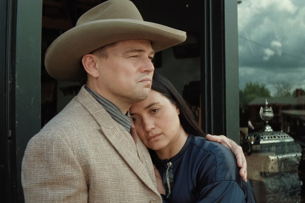 Ernest Burkhart (Leonardo DiCaprio) comforts his wife Mollie Burkhart (Lily Gladstone) amidst the murders of her family in Killers of the Flower Moon. (Photo: Paramount)
