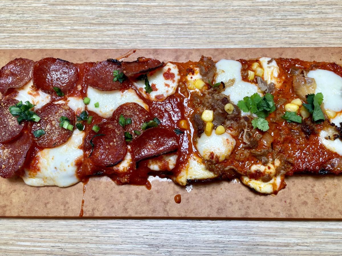 Combo Pizza — $20 Large, $15 Medium — Classic pepperoni pizza reinvented with mochi, topped with fresh garlic chives and Soy-Braised Beef, Korean style pizza with soy-braised beef, mozzarella cheese, corn, roasted garlic kimchi sauce and cilantro.