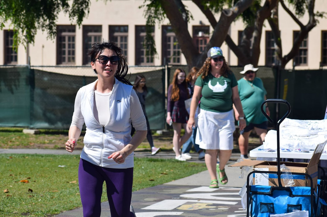 Biology teacher and event organizer Elizabeth Brimhall walks behind a participant in last year’s Mind Matters 5k, an event intended to raise mental health awareness. According to Brimhall, she was motivated to create the event after seeing the positive reaction to the Palo Alto Educators’ Association’s overnight walk many years prior. “I had this idea many years ago during the time of the suicide cluster, Brimhall said. A group of us from the Palo Alto Educators Association did something for the overnight walk for suicide prevention. After that walk happened, I went, ‘We should be doing something like this in our community.’ Finally, last year we were able to try to do something in a small way similar to that that tries to raise awareness.”