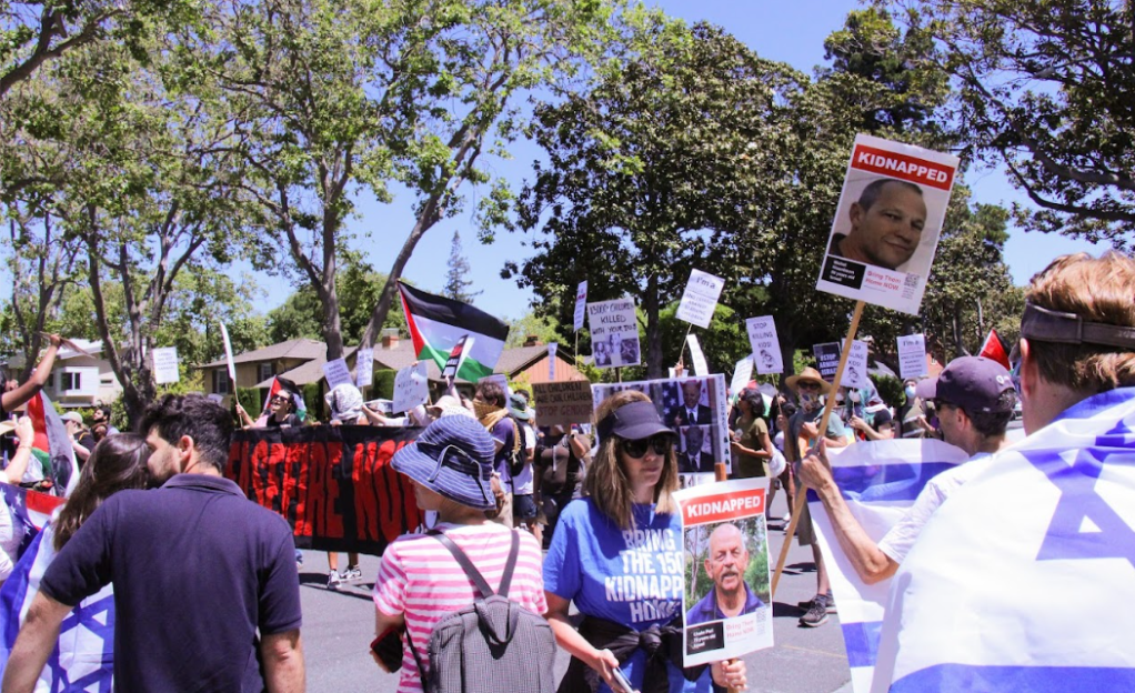 Pro-Israel and pro-Palestinian protesters block the road. The two sides had been operating separately for the day but faced off in the center of the road ahead of Bidens arrival.