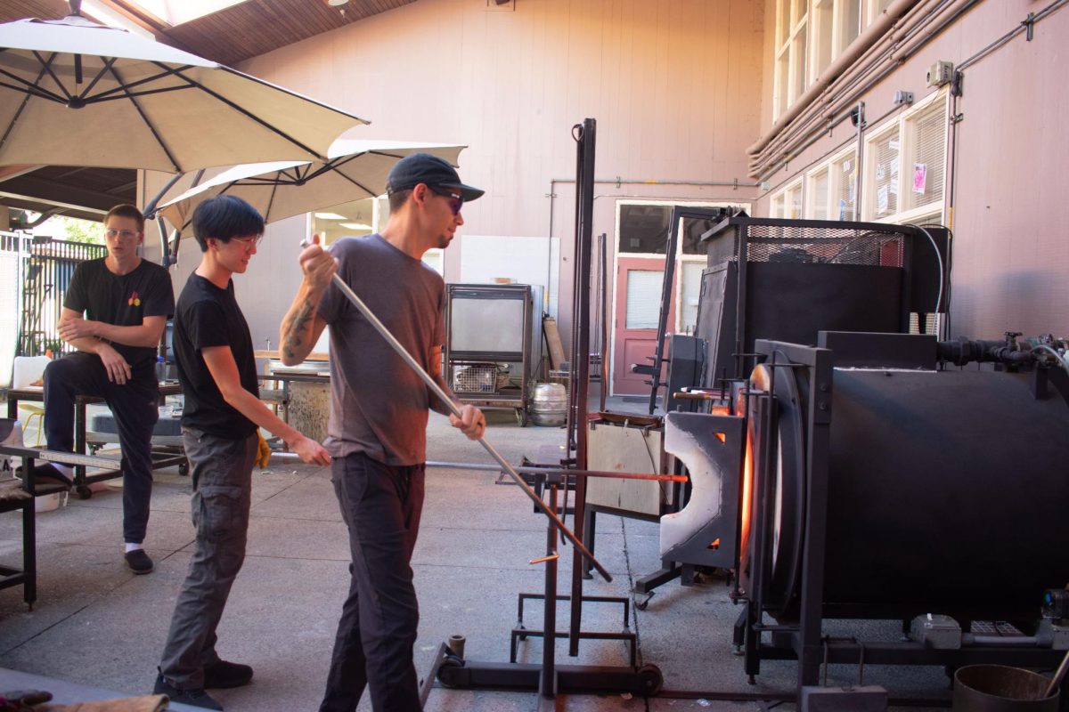 New glassblowing teacher Michael da Ponte encourages students to be more creative with art, showcasing to his third period class how to use the furnace in the art building. Having previous experience as a professional artist, Michael da Ponte said he hopes to teach students the value of art education. "Rediscovering myself through teaching is something that motivated me to continue down the path of education," Da Ponte said. "I don't like to gatekeep anything." 