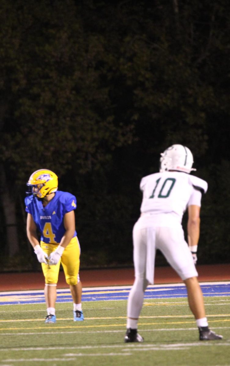 Senior safety and reciever Jeremiah Fung prepares for the snap against Oak Grove last week. According to Fung, the Vikings have been playing close attention to detail throghout the week in preparation for Christopher tonight. "We've been going over their schemes and plays throughout the whole week." Fung said."I have confidence that the work we've put in will help us get it done tonight."