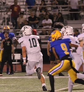 Senior captain Jeremiah Fung returns an interception to the endzone for Viking's fourth touchdown agaisnt the Oak Grove Eagles Friday night. Fung said that he his team blocking for him was key in the score. "I knew my brothers were blocking for me so it had to be a housecall," Fung said.