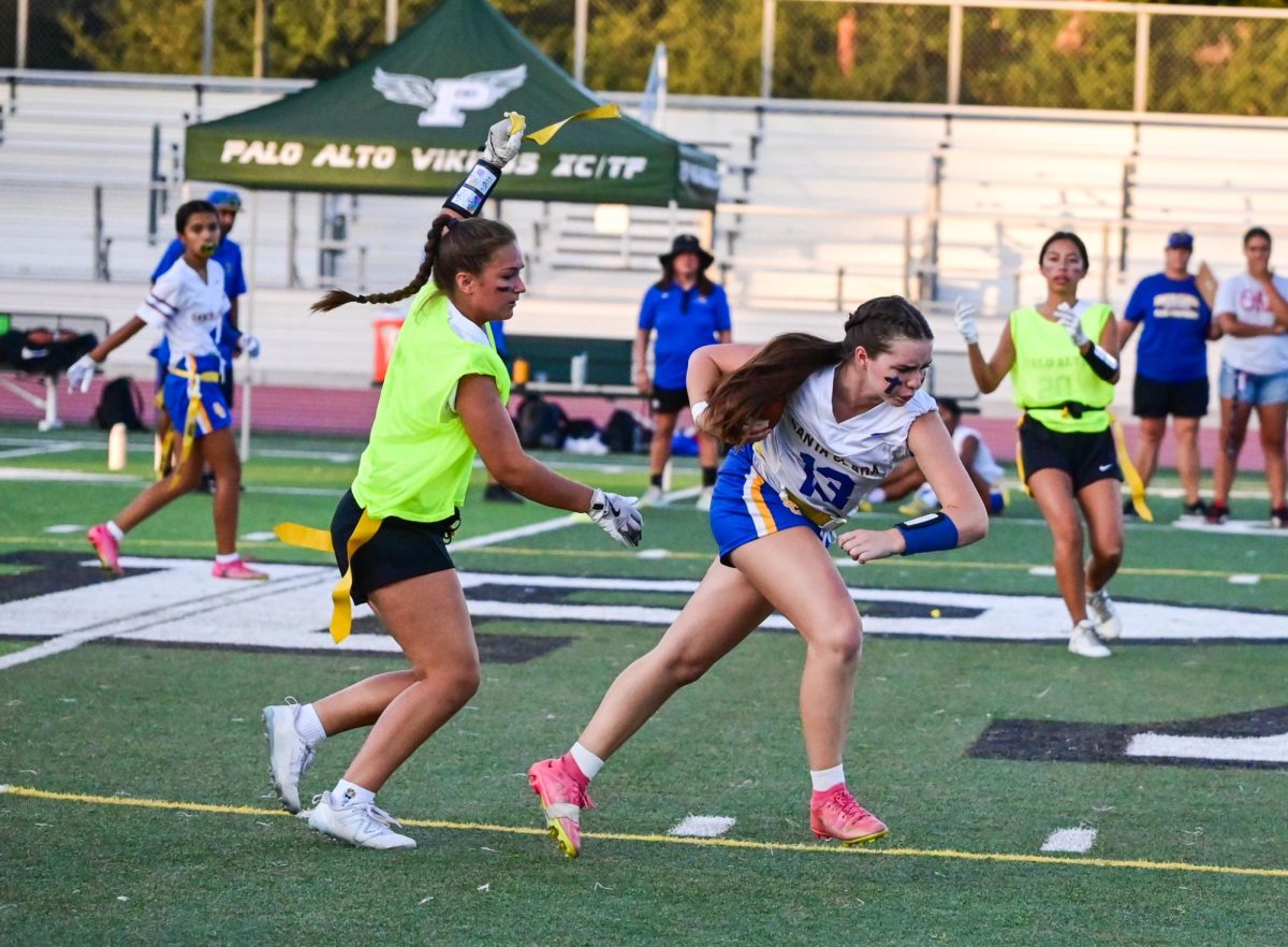 Viking defender Natalie Dymmel chases down Bruins junior Gabriella "Gigi" Gonzalez in the second half of the game at the Earl Hansen Football Stadium, Monday Oct 7th. According to Viking junior wide receiver and defensive back Danica Chew, the team played solid defense but occasionally struggled with making progress on the field. “Our defense was so good today, they were pulling those flags really fast,” Chew said. “I think our offense needs to work on some shorter passes.”
