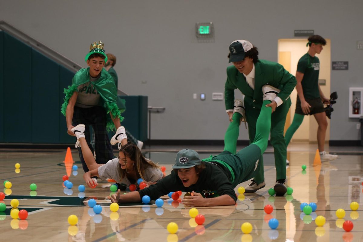 Students compete against each other to gather the most balls during a game of Hungry-Hungry Hippos, featured in the first Spirit Week rally of the year  at Palo Alto High School. According to sophomore Tessa Berney, she enjoyed watching the activity. “I was really happy with the Hungry-Hungry Hippos,” Berney said. “I missed that last year, and it's actually a lot more elaborate than I thought.”