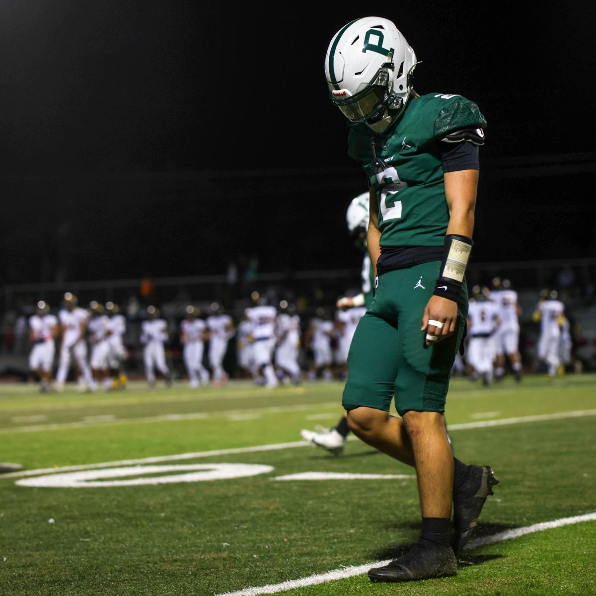 Sophomore quarterback Justin Fung walks off the field in defeat after a 13-42 loss against Wilcox High School last Friday. According Fung, getting a win tonight will get that momentum right back for the Vikings. “There’s always going to be bumps in the road,” Fung said. “But what we gotta do is work together and get through it. Whatever happened last week happened. Now we’ve been focusing on our gameplan and have had a couple of great practices giving me confidence that we can execute come game day”