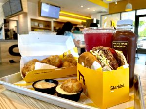 The Cali Gold BBQ sandwich (right), Chicken Nuggets (left), and House-made Iced Tea make a perfect meal at Starbird. 