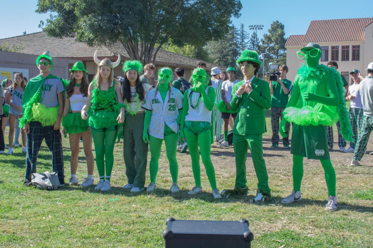 The green costumes worn by Palo Alto High School students blend into the Quad during the first "best-dressed" competition of Spirit Week. According to senior Heiren Noone, her favorite part of Spirit Week is the class competition. "[The best part of Spirit Week is] dressing up and beating the other grades," Noone said.